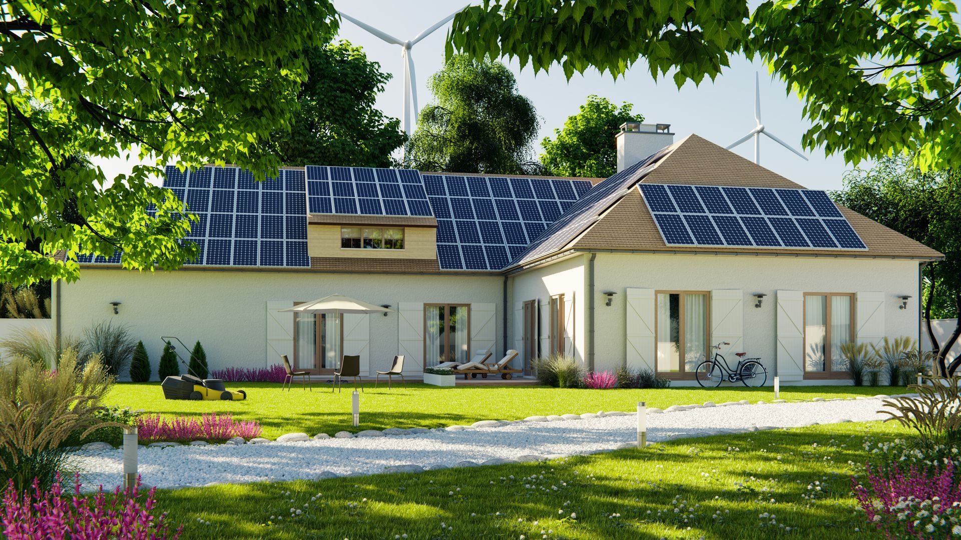 House with solar panels on roof, green lawn, wind turbines in background, sunny day.