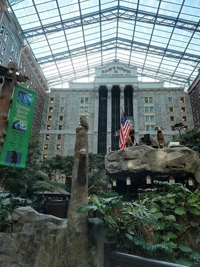 A large building with a roof that is covered in glass.