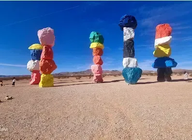 A group of colorful rock sculptures in the desert