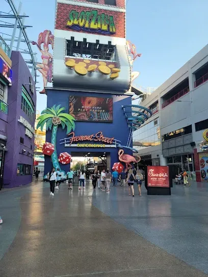 People walking in front of a building with a sign that says souther