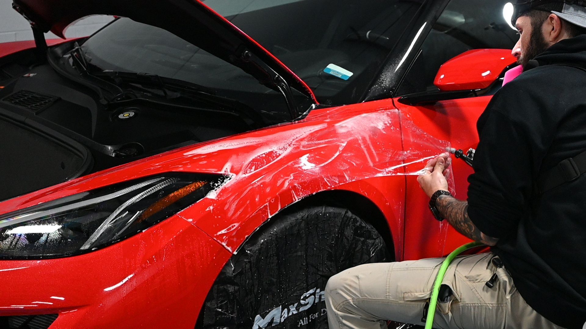Car surface showing results of how to apply paint protection film professionally.