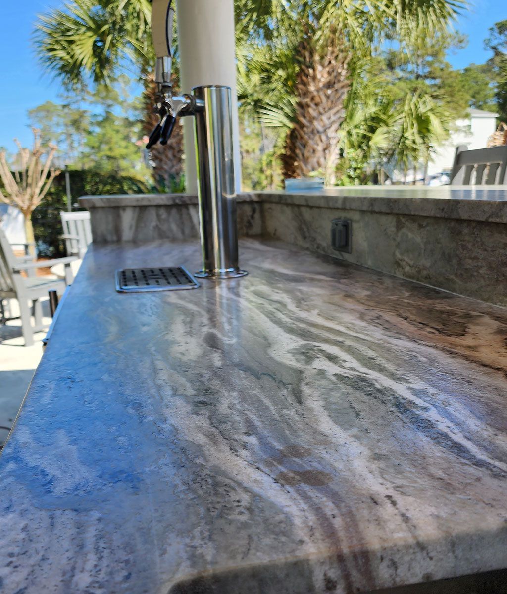 a close up of a counter top with a tap on it .