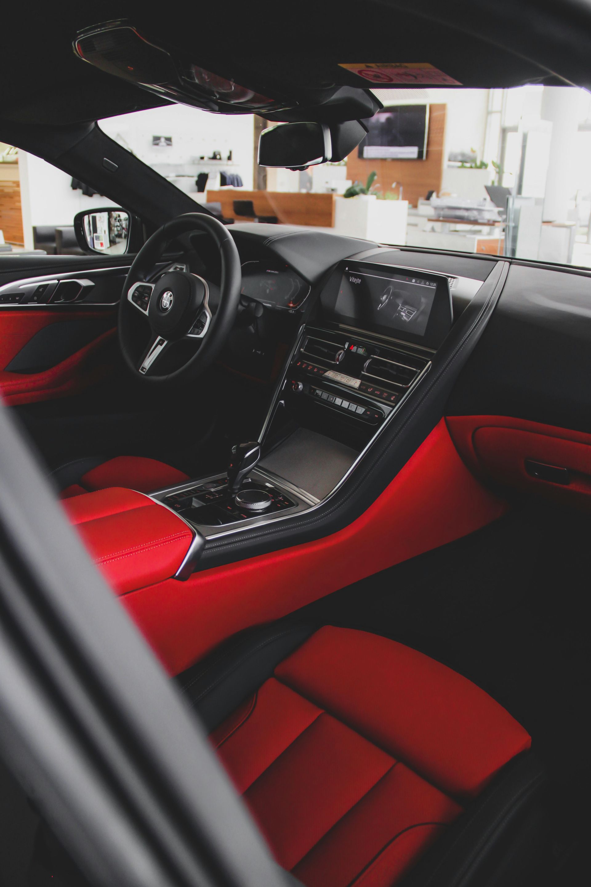 Black BMW interior with red leather seats.