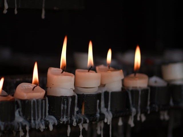 A row of candles creates a peaceful and comforting scene for cremation services Burnsville, MN
