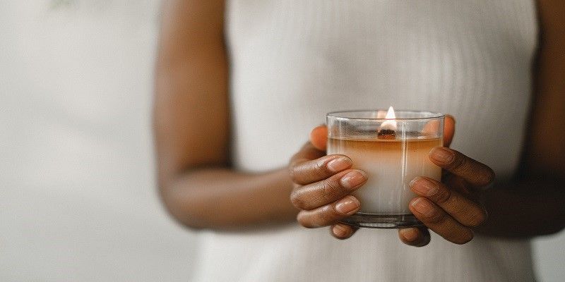 Person holding a memorial candle symbolizing compassionate Chaska, MN cremations and meaningful remembrance services