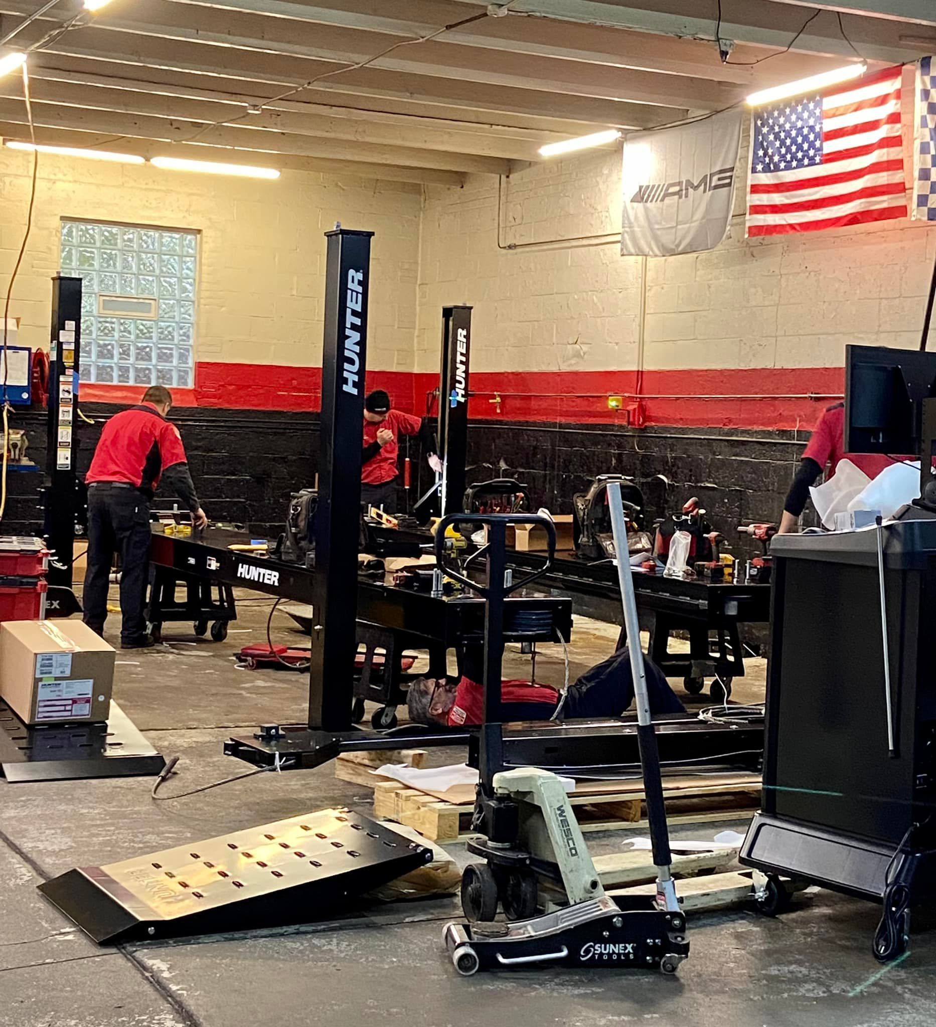 Inside the auto shop with multiple car lifts, tools, and mechanics | MAG Motors