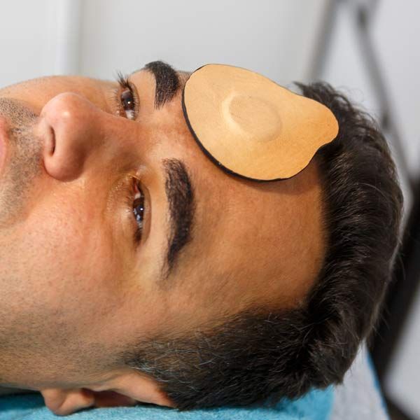 Man receiving Biomagnetic Therapy