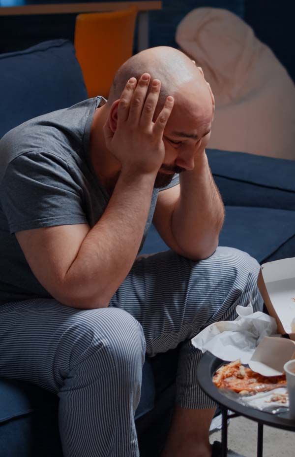 Man on a bad diet needing Pain Relief from Severe and Chronic Headaches by Marc Bystock NYC Acupuncturist in Midtown Manhattan NY 10016