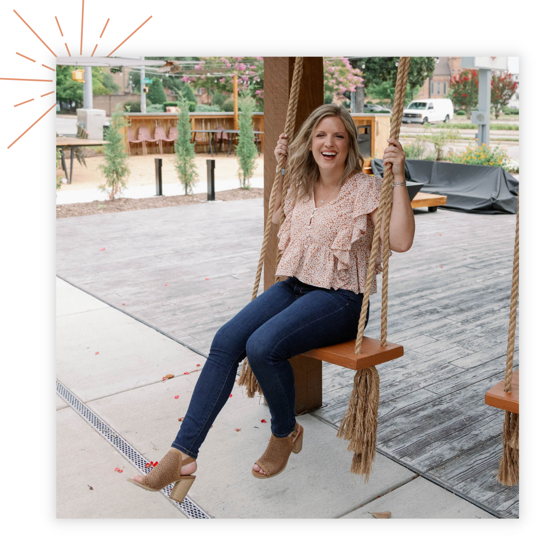 Leigh Saner sitting on a swing