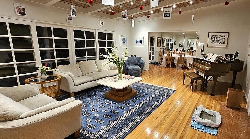 A living room with a piano and a couch