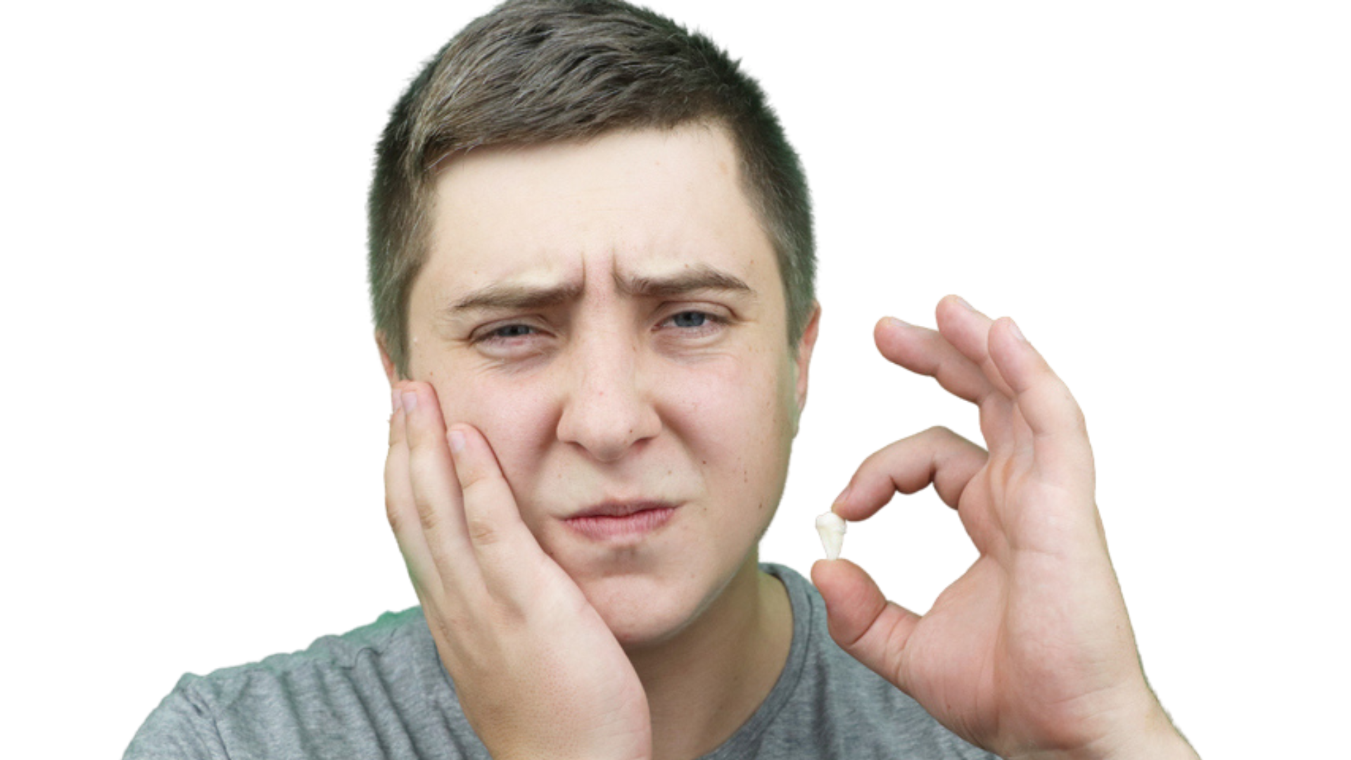 A person holding a small tooth in their fingers, holding their hand to their cheek in pain. Isolated on white background.