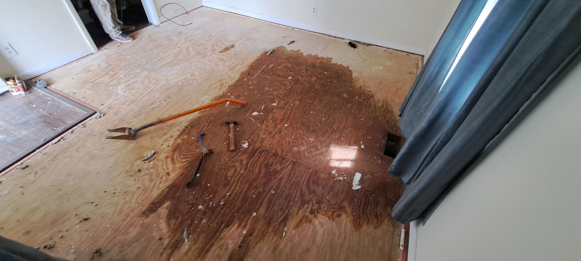 An aerial view of a room with a pile of dirt on the floor.