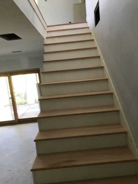 A set of stairs leading up to the second floor of a house
