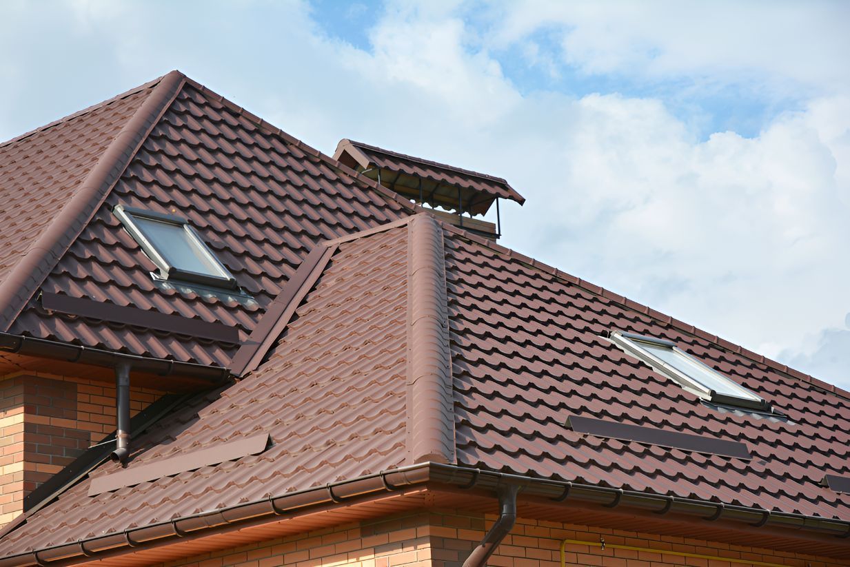 A House With a Brown Roof and Two Skylights on It — Goonellabah Roof Tilers In Evans Head, NSW