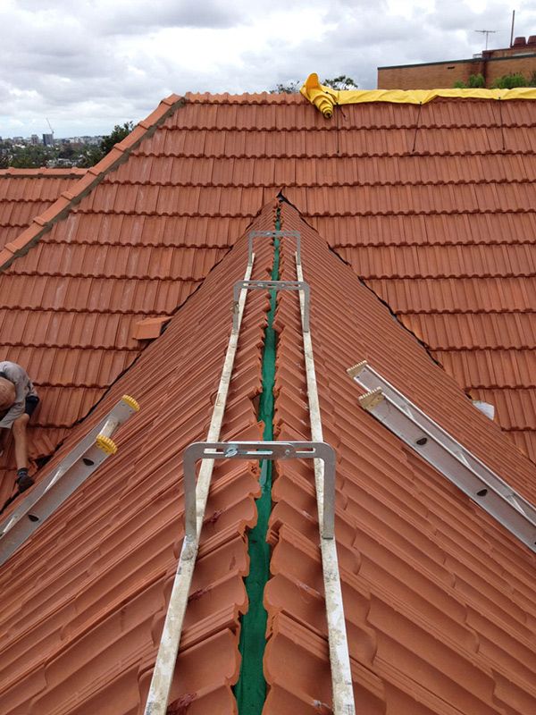 Ladders on a Roof — Goonellabah Roof Tilers In Monaltrie, NSW
