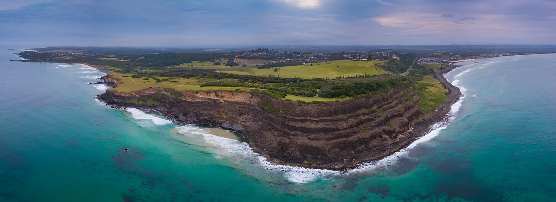 An Aerial View of a Small Island in the Middle of the Ocean — Goonellabah Roof Tilers In Lennox Head, NSW