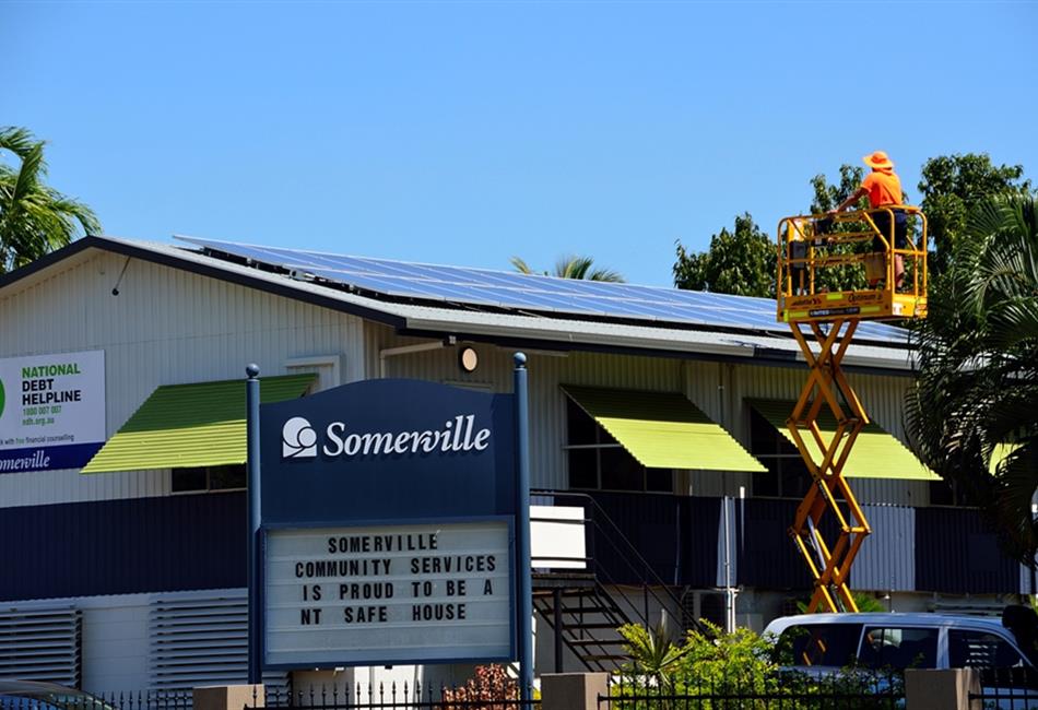 a sign that says somerville on it in front of a building