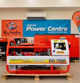 a kubota power centre generator is sitting on a wooden pallet in a room .