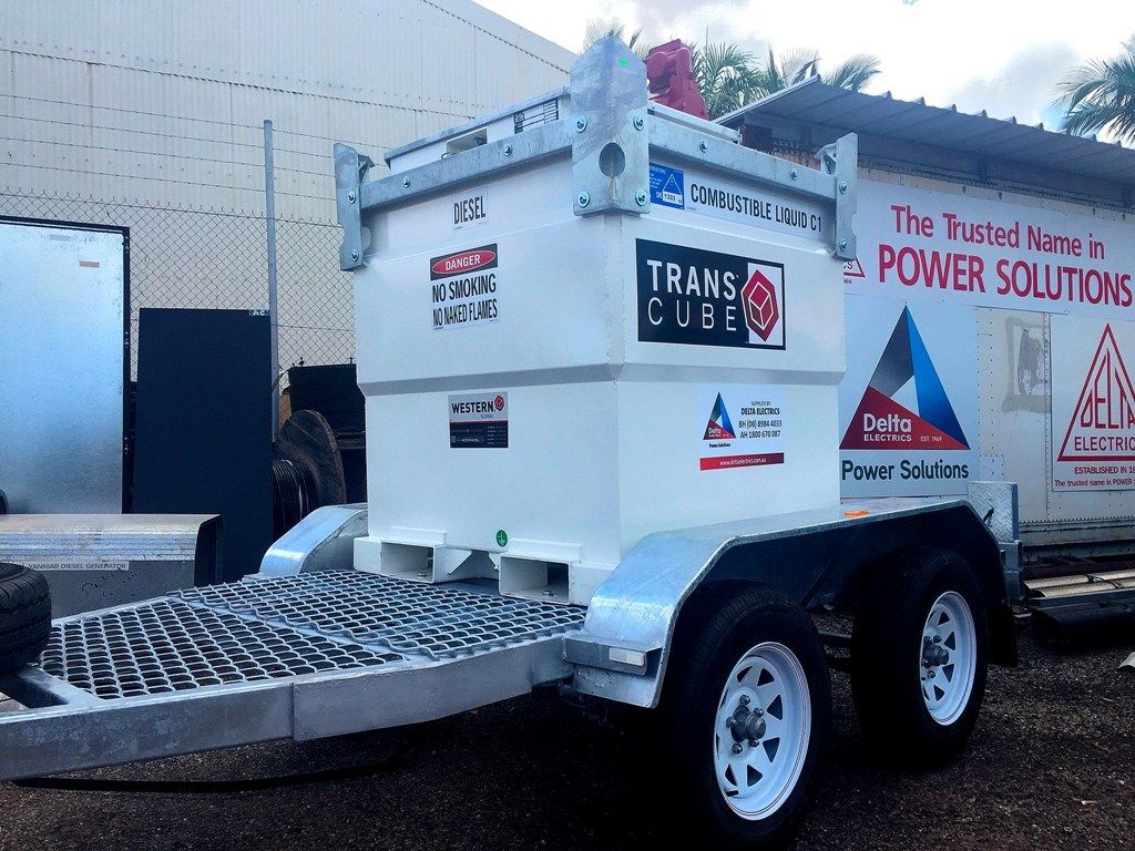 a trailer is parked in front of a building that says power solutions