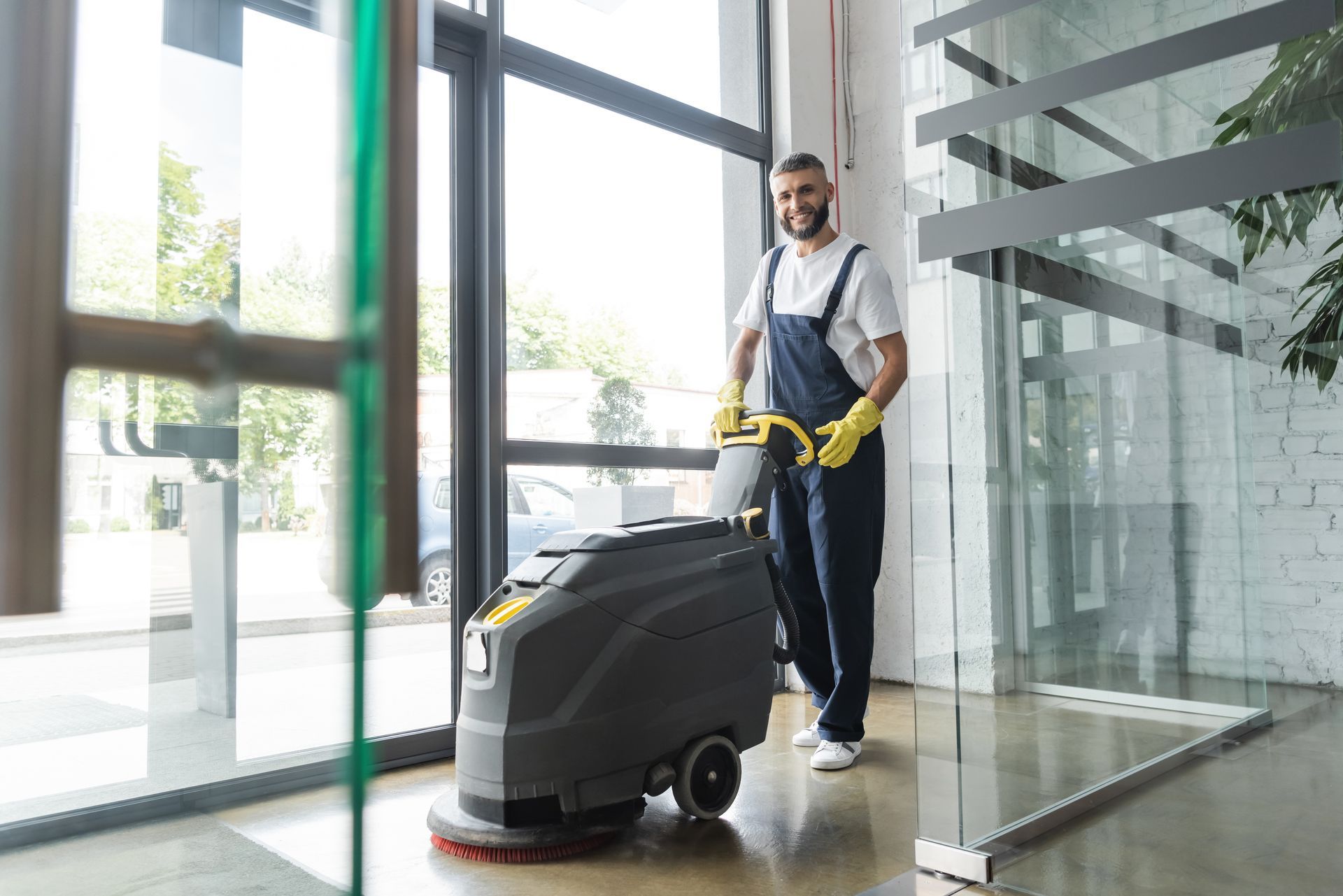 cleaning a tile floor with buffing machine