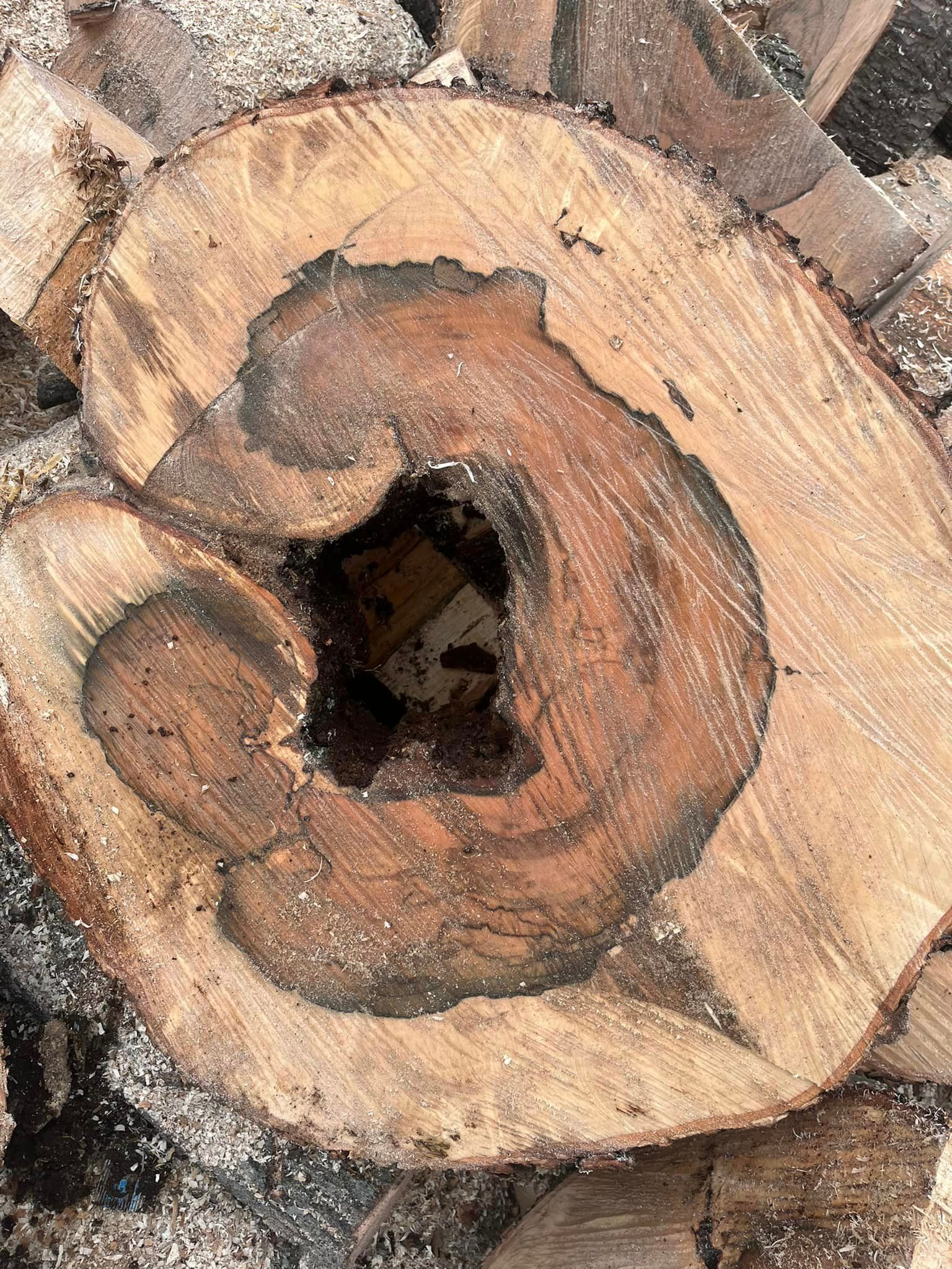a close up of a piece of wood with a hole in it .