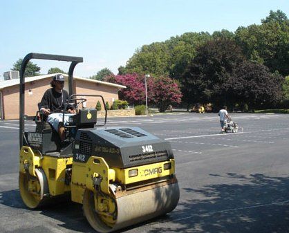 Workers Paving Parking Lot — Asphalt Paving Contractor in Germantown, MD