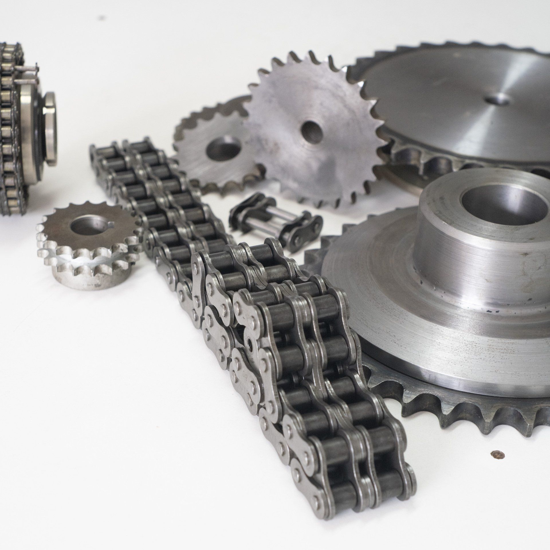 A bunch of gears and chains on a table