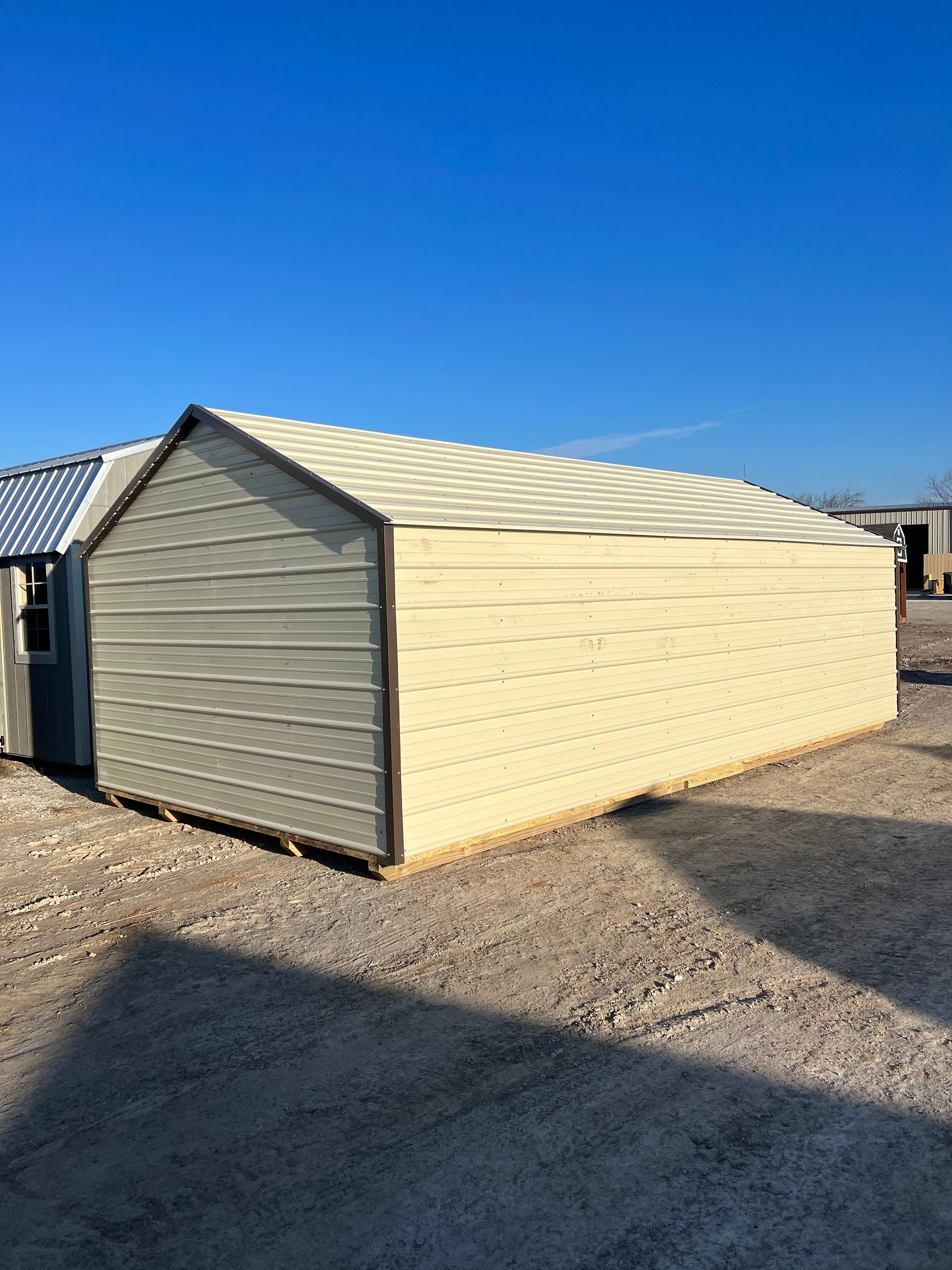 A white garage with a blue sky in the background