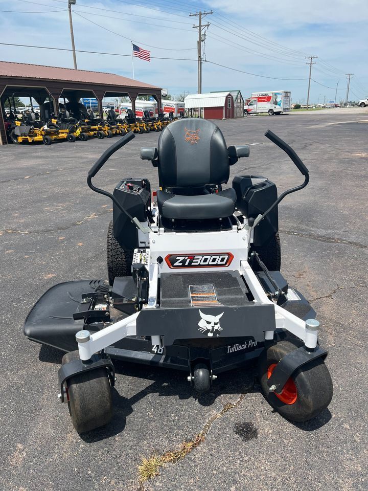 A bobcat zero turn lawn mower is parked in a parking lot.