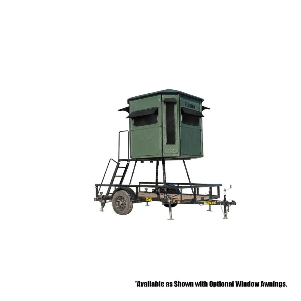 A green deer blind on a trailer with a ladder.