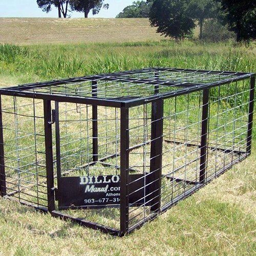 Dillon hog traps sitting in a field