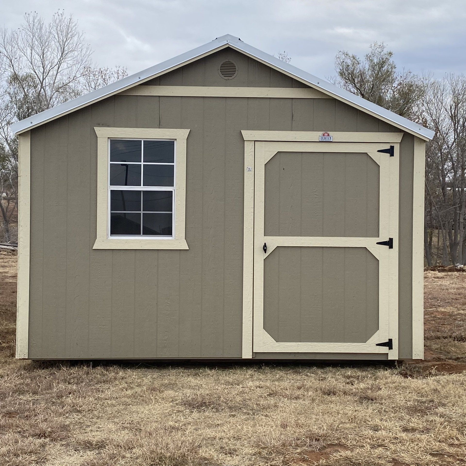 A best value wood side utility shed  with a white door and a window has the letter a on it