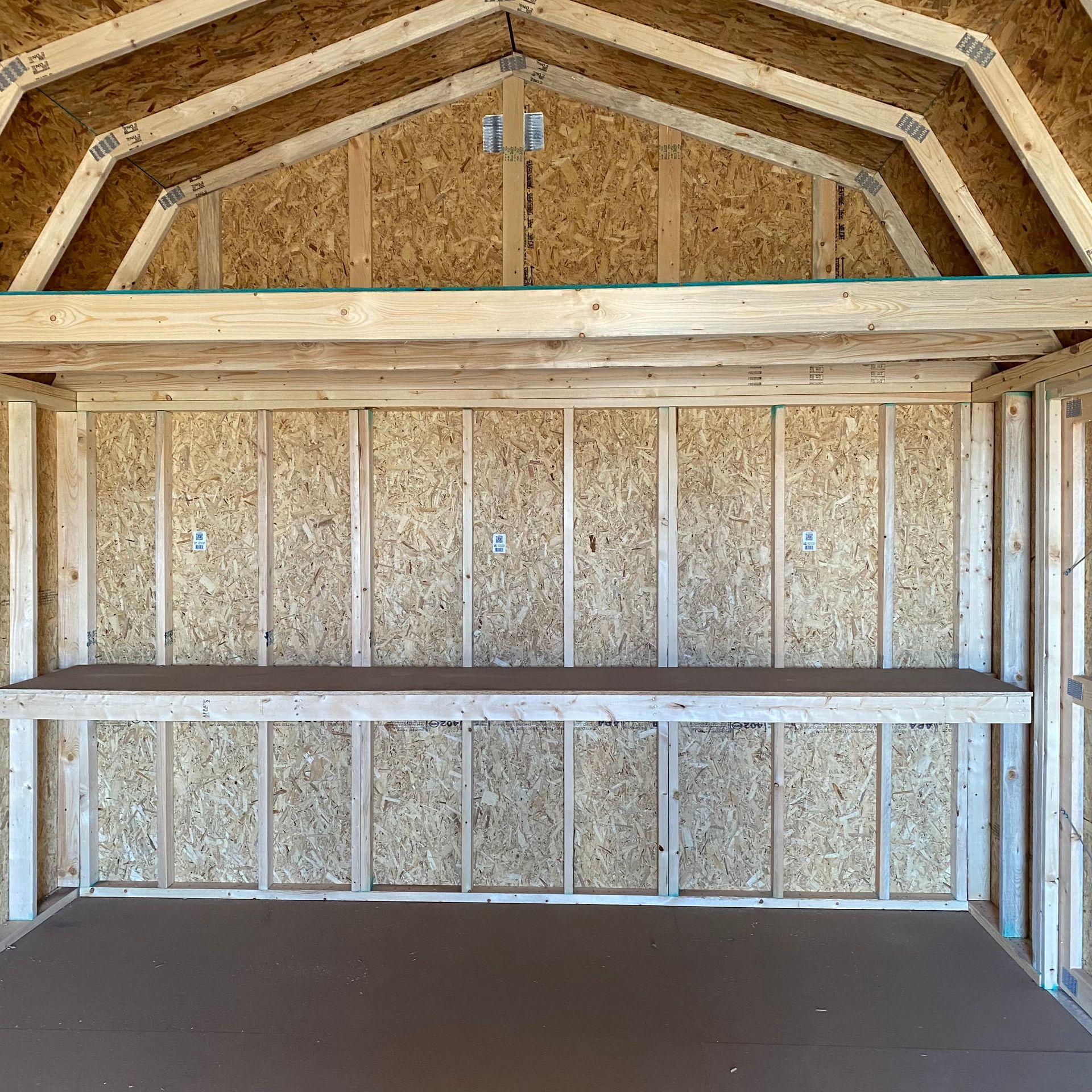 Interior of 12x20 Portable Barn with work bench shown