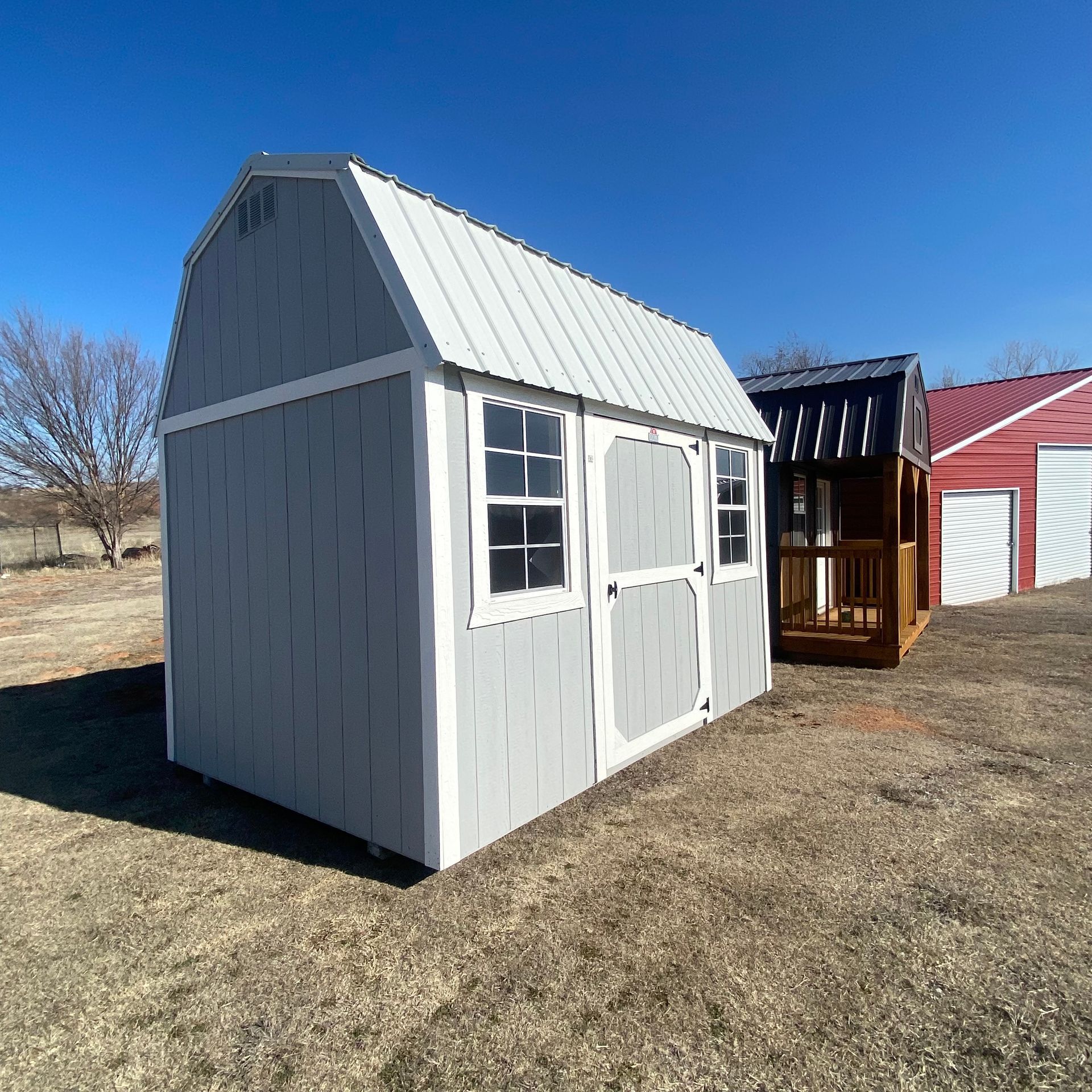 a shed with a white roof 8x12