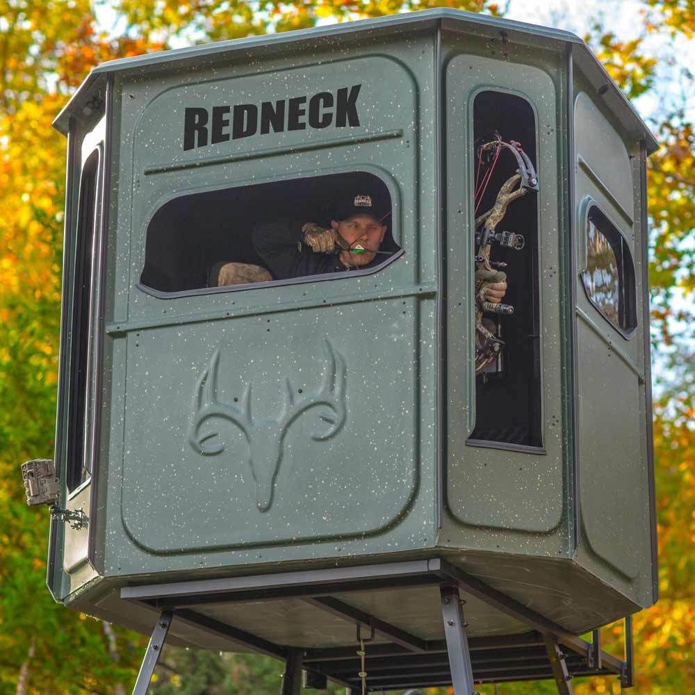a guy sitting in a redneck hunting blind 