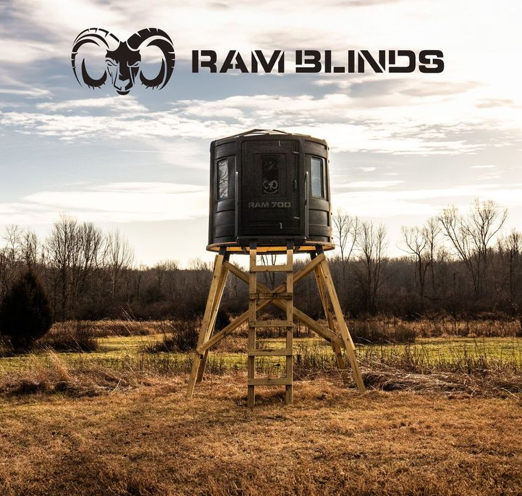 A ram blind is sitting in the middle of a field