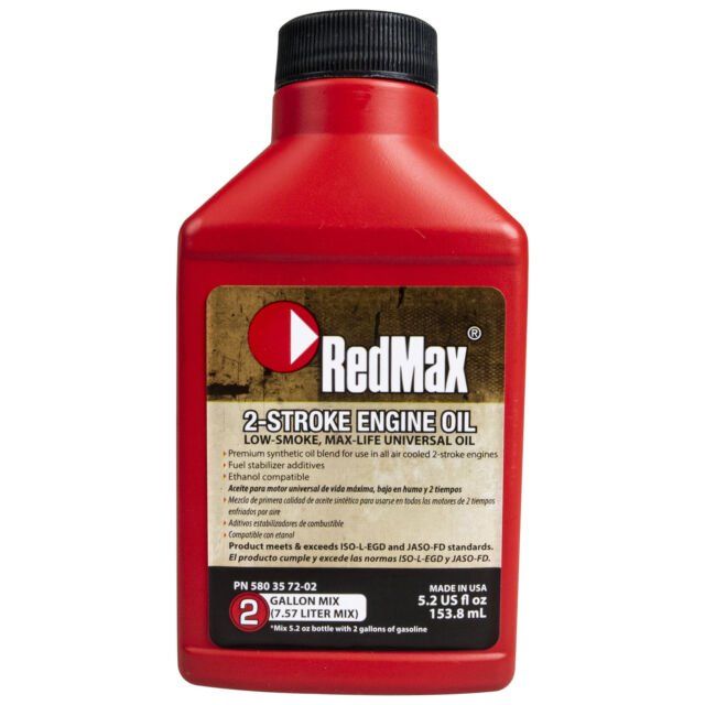 A red bottle of redmax 2 stroke engine oil