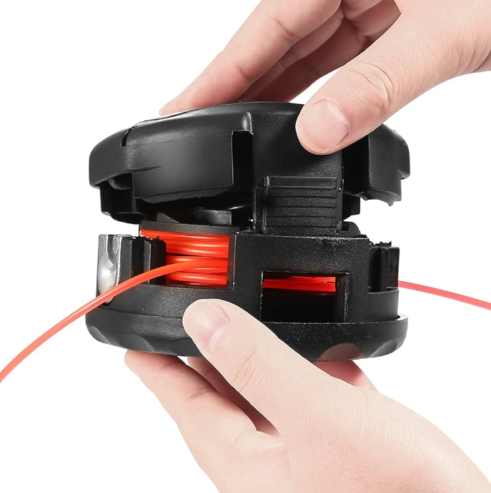 A person is holding a trimmer head with a red wire in it