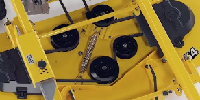 A close up of the bottom of a yellow lawn mower.