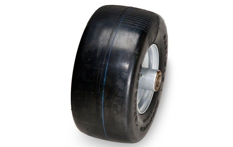 A black tire with a silver rim on a white background