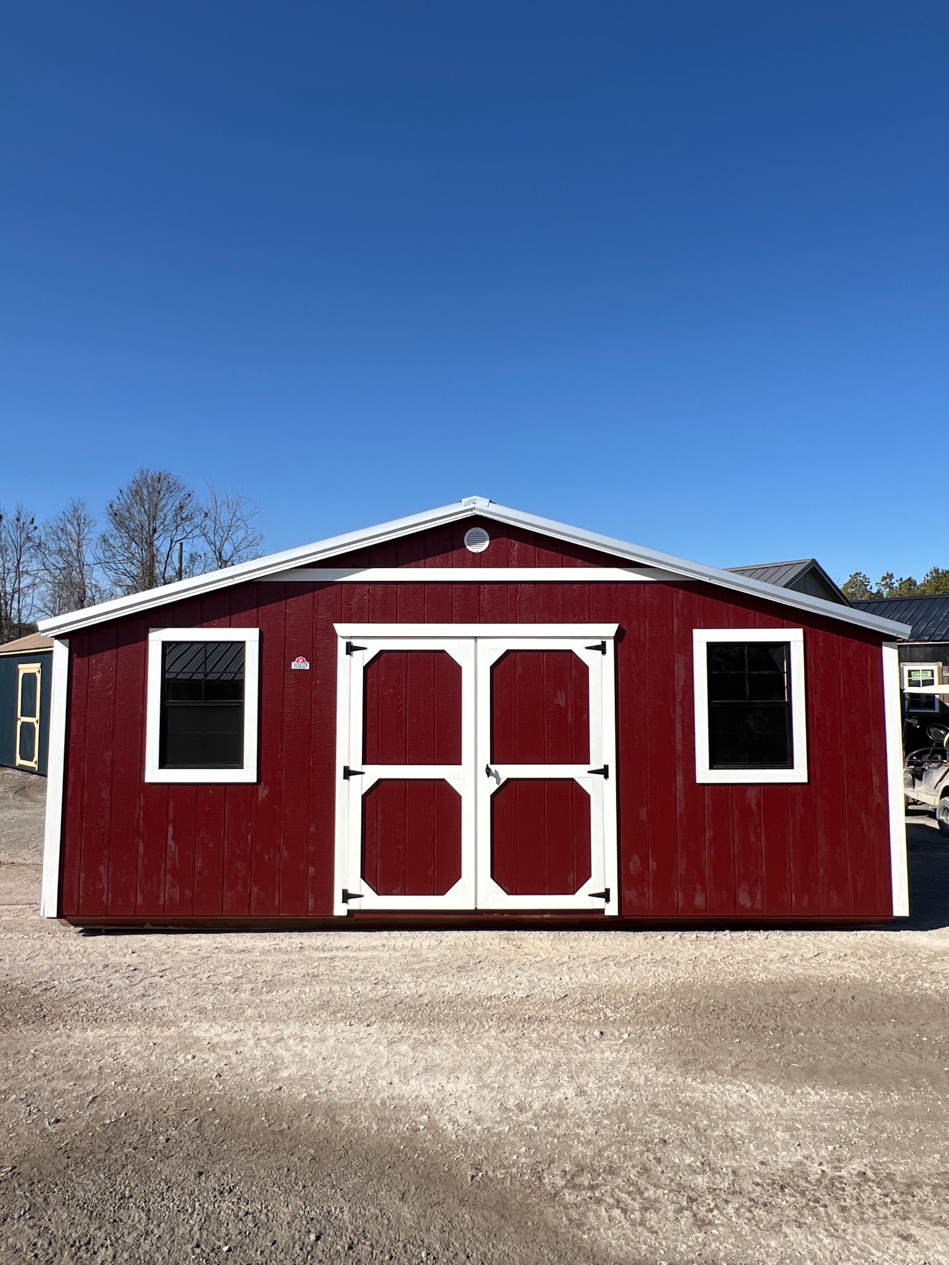 Explore the Derksen Best Value Wood Side Utility 12x20 with Barn Red Paint, durable roofing, and elegant design - perfect storage solution!