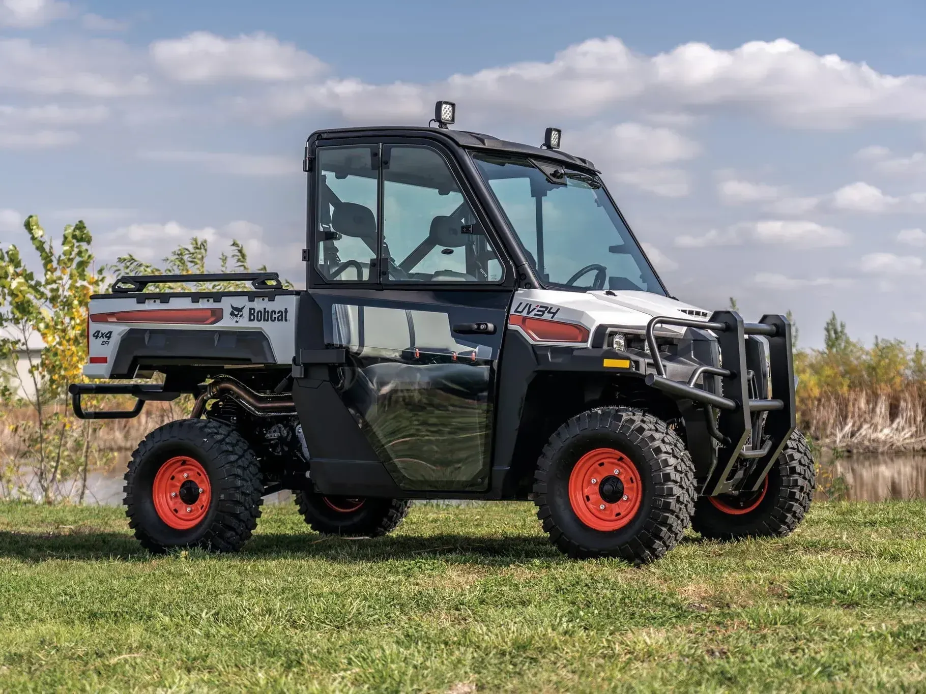 a bobcat vehicle is parked in a grassy field