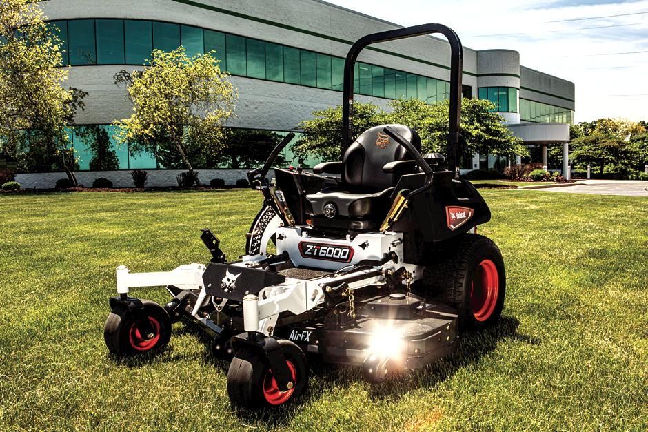 a bobcat tractor is loading rocks into a bucket