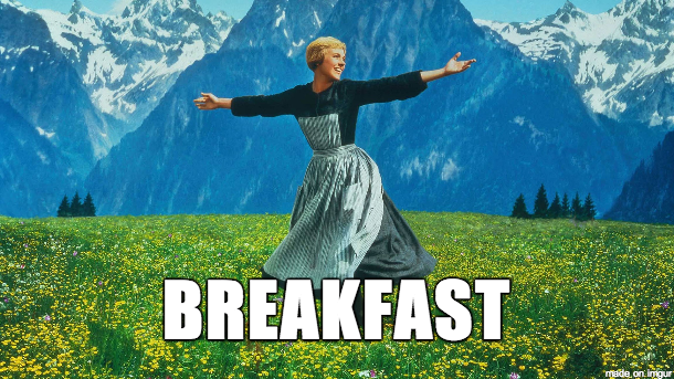 A woman is dancing in a field with the word breakfast above her