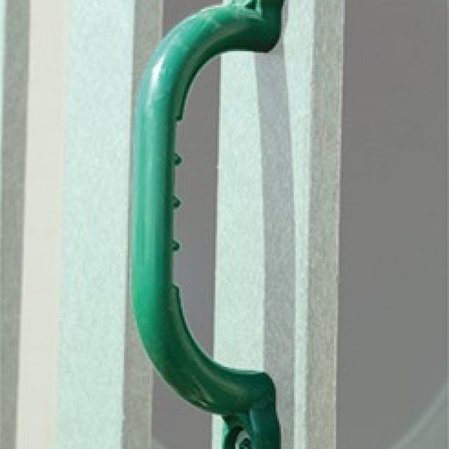 a green handle is attached to a white railing .