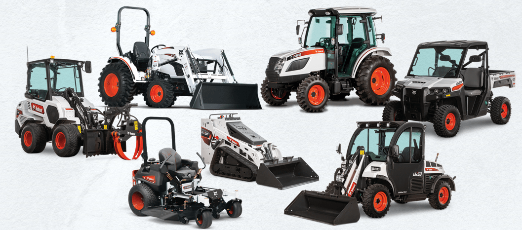 A group of bobcat tractors are sitting next to each other on a white background.