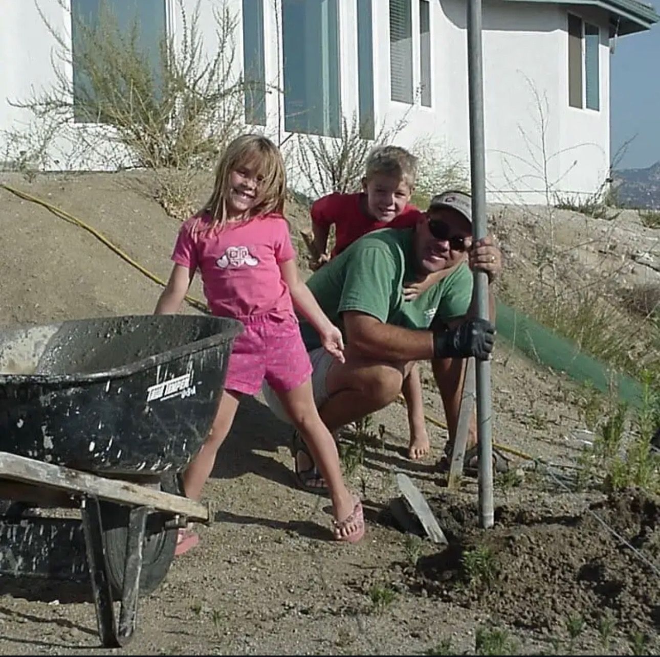 Dana, Sheridan, and Riley helping in the yard