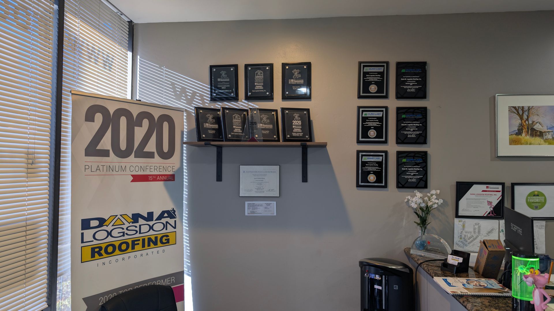 Dana Logsdon Roofing & Solar Award Wall