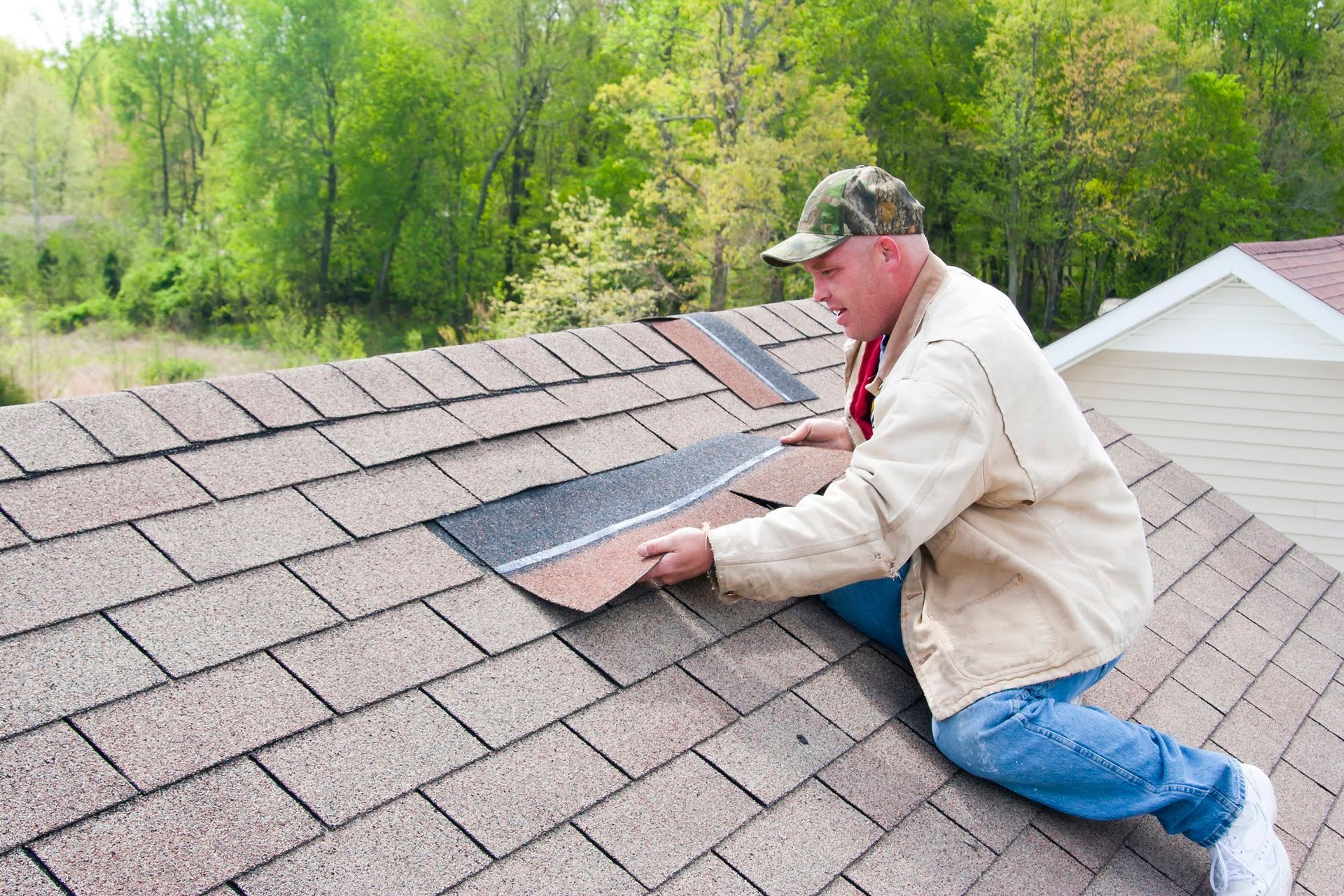 a man on a roof installing new asphalt shingles in el cajon, ca