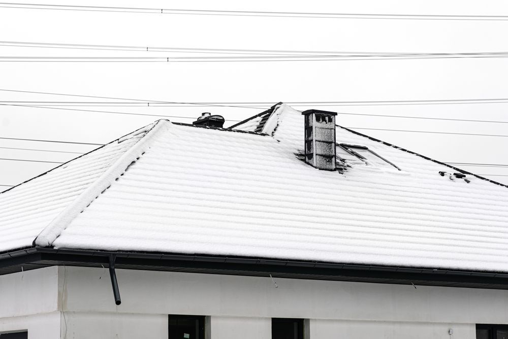 Impact of Weather on Roofing: Snow Build-Up on Roof